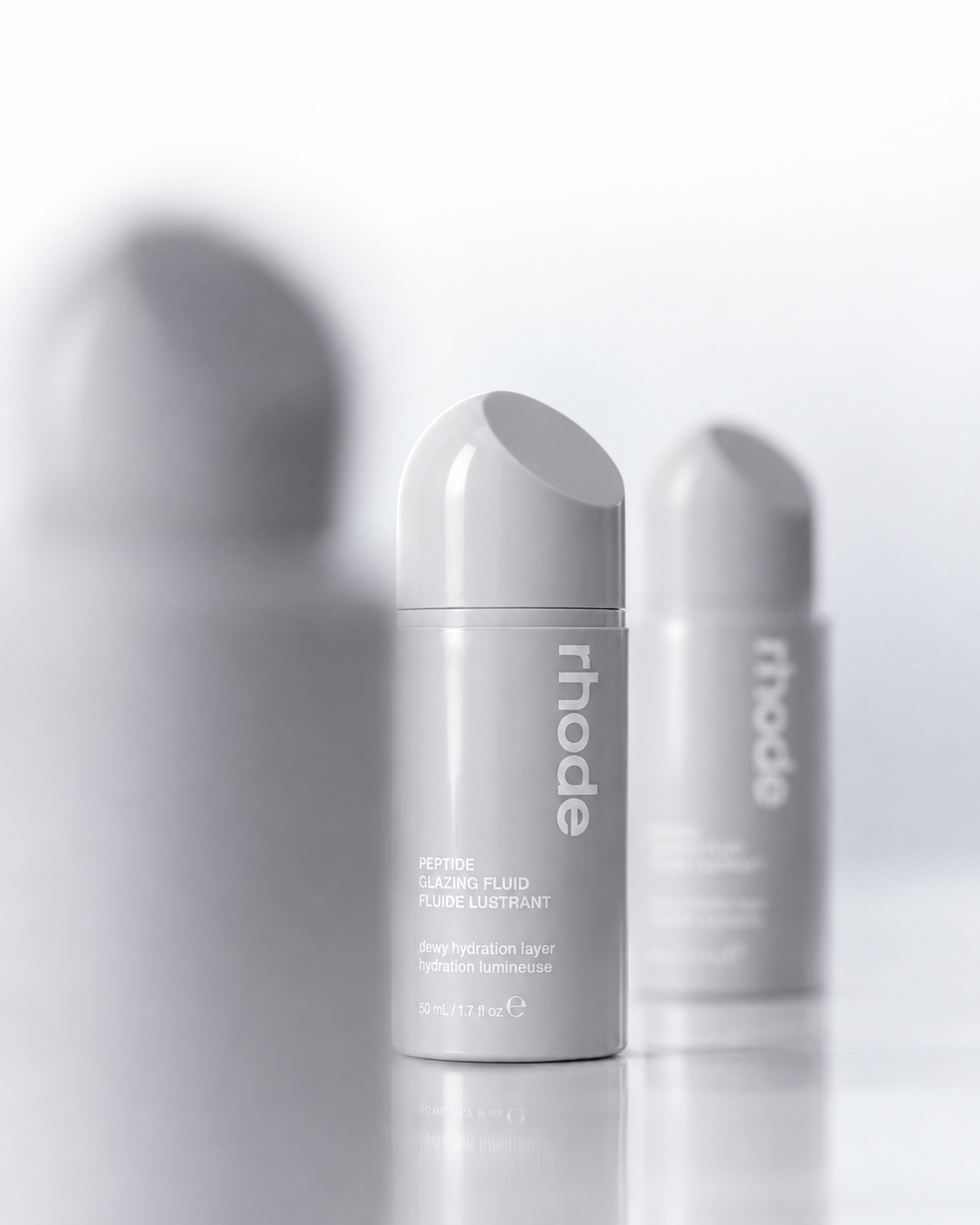 Studio direction — the same skincare fluid bottle